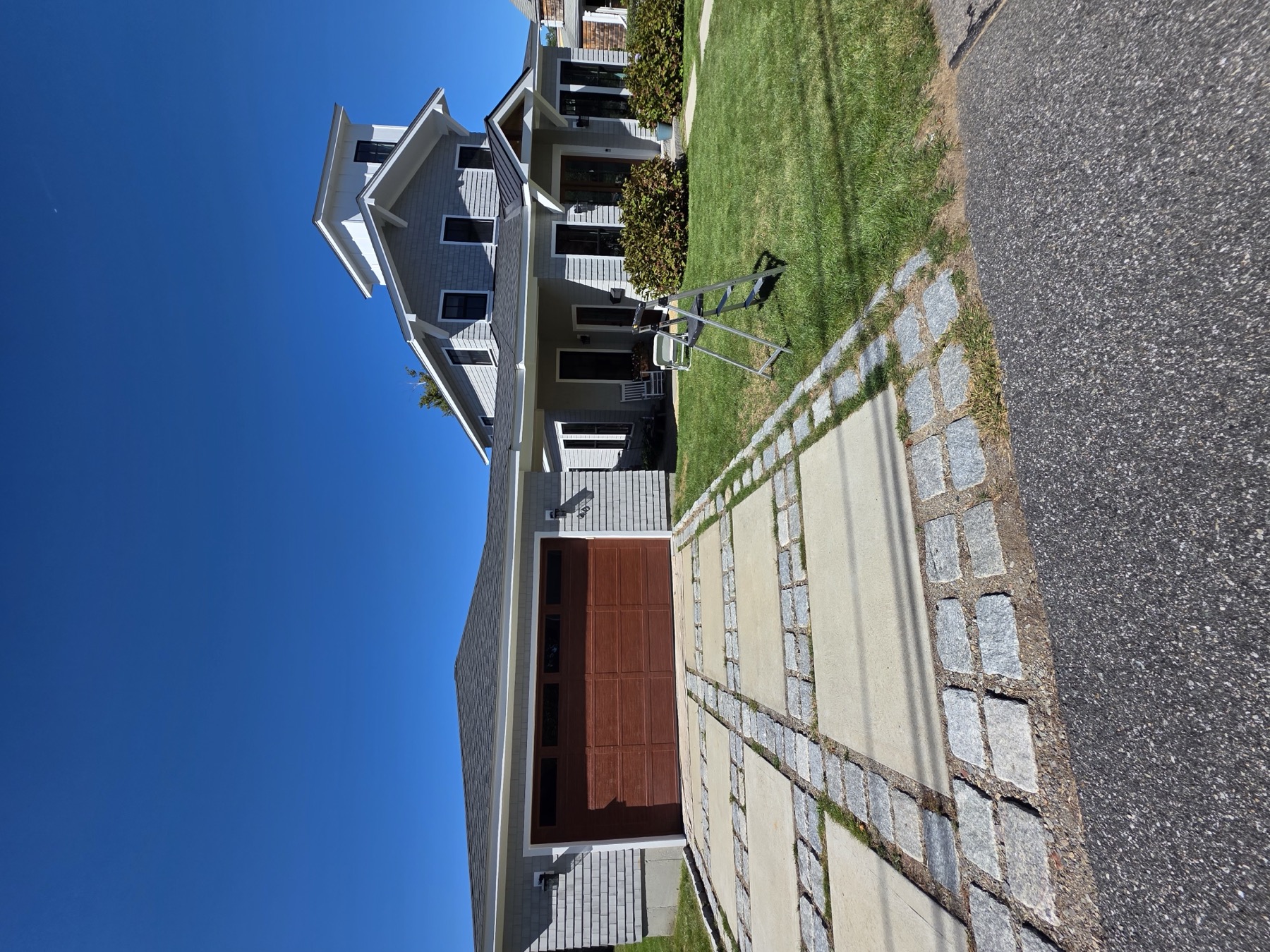 Finished exterior repaint of a home with a cupola