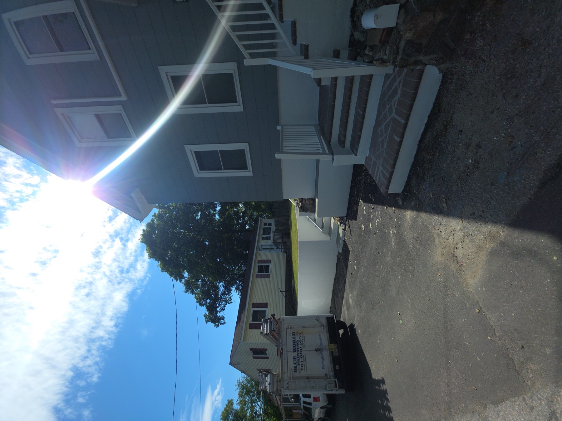 Painting Blue World Inc. work van on site